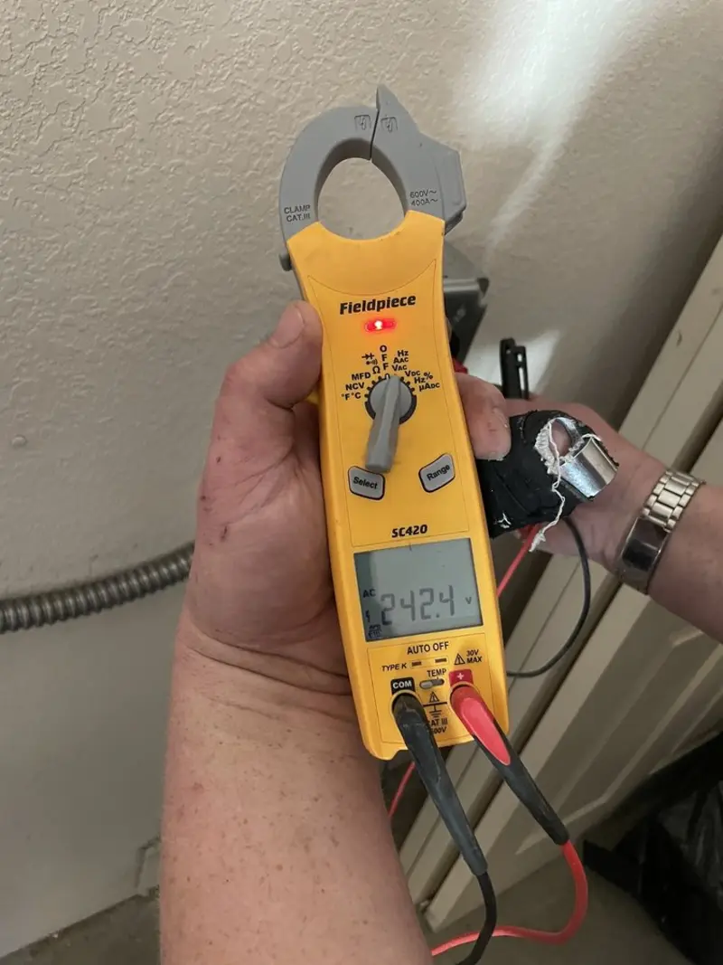 Voltage testing with clamp meter during Generator Installation in Bell Gardens